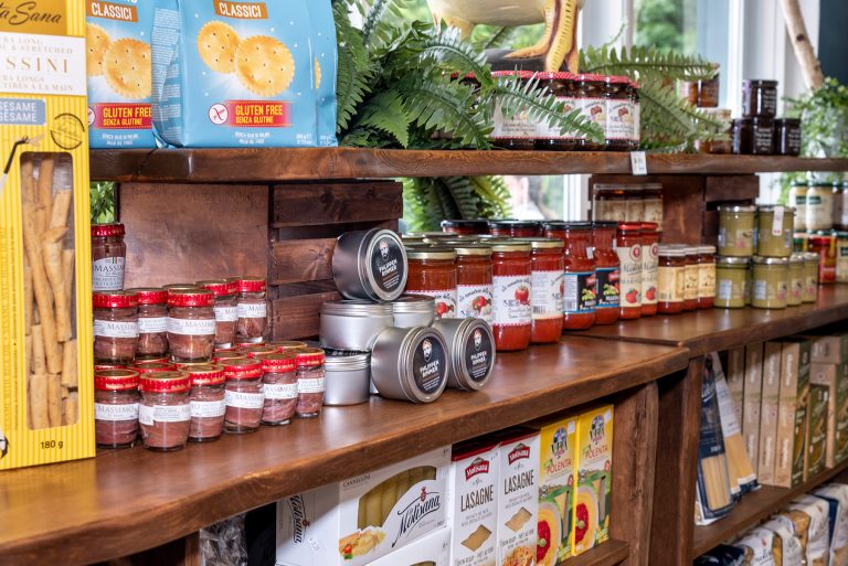 Agram Meats & Culinary Boutique shelves filled with pasta, sauce, breadsticks and other dried and canned goods.